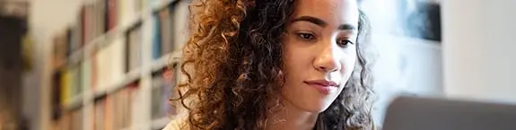 woman using laptop at home