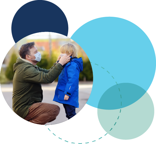 man helping son with covid mask